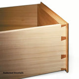 Close-up of a wooden box corner showing rabbeted dovetail joints for woodworking projects.