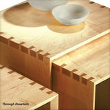 Close-up of wooden boxes showing precise through dovetail joints for woodworking projects