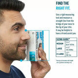 Man measuring face with ruler and mask box for filtration mask size guide