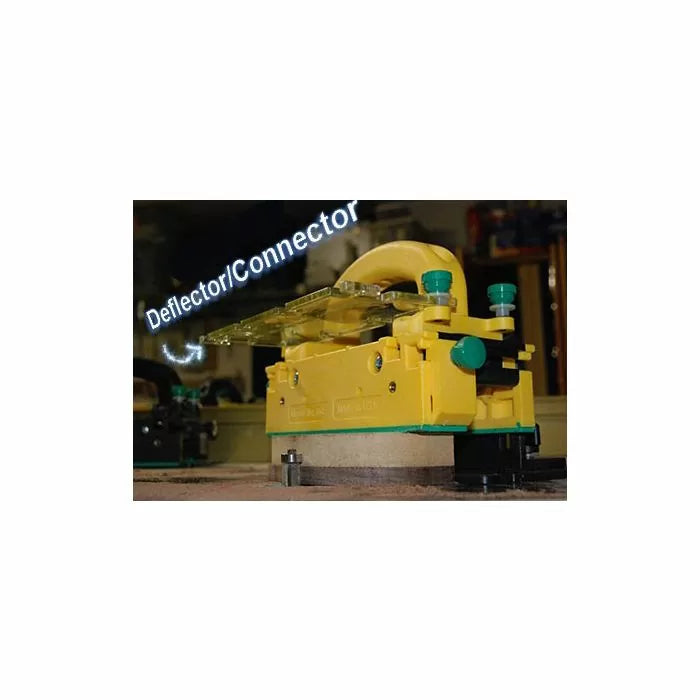 Yellow deflector connector attachment for woodworking router table, close-up view