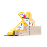 Yellow woodworking gauge tool measuring wooden board thickness on a router table