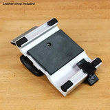 Adjustable woodworking honing guide for sharpening tools on wooden workbench