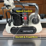 Woodworking feeder with labeled speed control, on/off, and forward/reverse switches