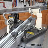 Table saw fence system with hold-down and featherboard in woodworking shop