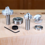 Woodworking router bit set with bearings and hex key on a wooden workbench