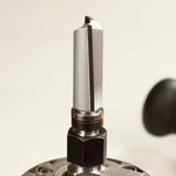 Close-up of a straight carbide router bit installed in a router, woodworking tool detail