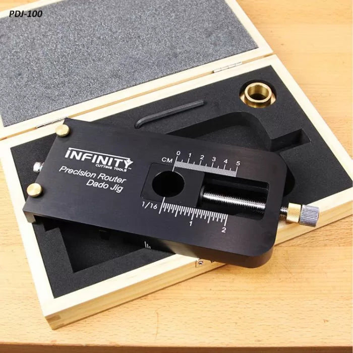 Precision router dado jig with measurement scale in a foam-lined wood case on workbench