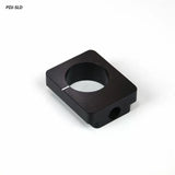 Black square jig stop block for woodworking tools, precision machined, on white background.