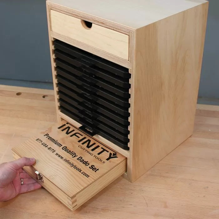Wood dado blade storage box with labeled sliding drawers for woodworking tools.