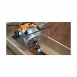 Woodworking router with clear base and straight bit in use on wood slab