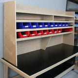 Woodworking workbench with shelves and organized storage bins for shop tools and parts