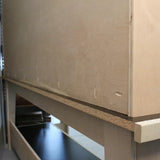 Close-up of woodworking joinery using pocket holes on a plywood workbench frame