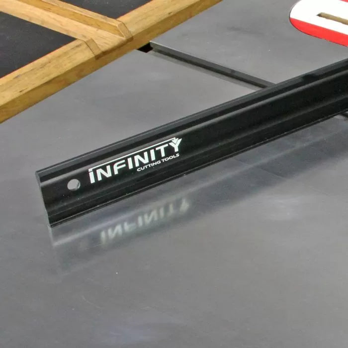 Table saw crosscut sled with black aluminum fence for woodworking precision