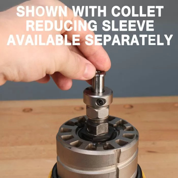 Hand inserting collet reducing sleeve into metal router, woodworking tool on workbench