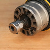Close-up of a woodworking router collet and base on a wooden surface
