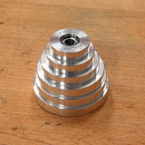 Aluminum stepped setup gauge for woodworking on a wooden workbench