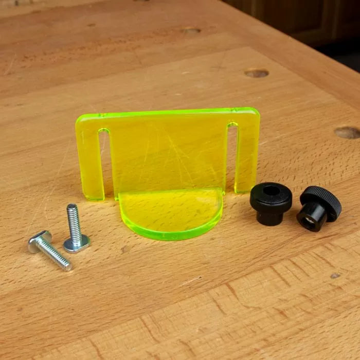 Router table safety guard kit with acrylic shield, knobs, and bolts on a wood workbench