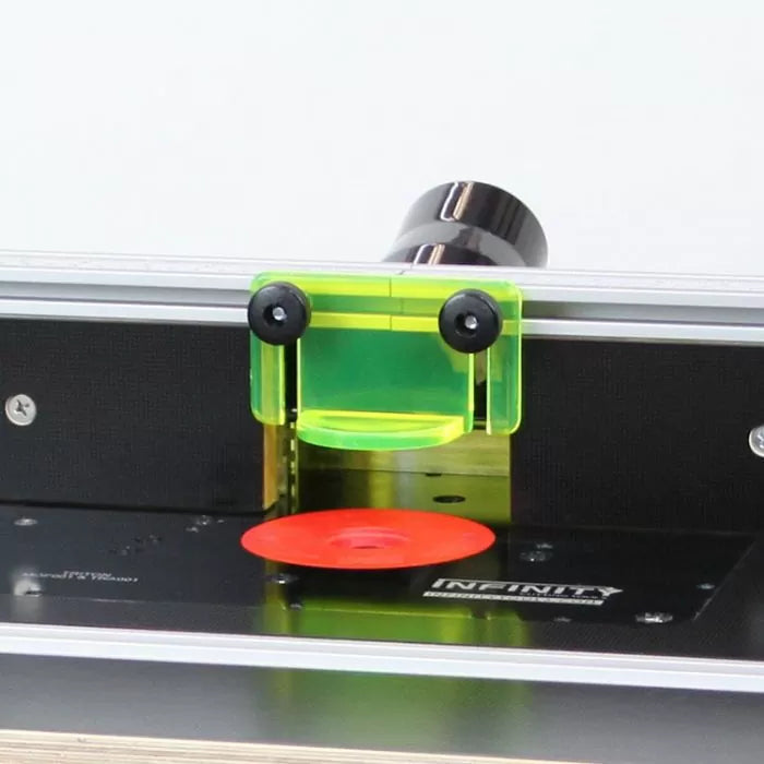 Router bit safety guard on router table with dust collection port