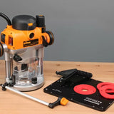 Woodworking router tool with router table plate and accessories on workbench