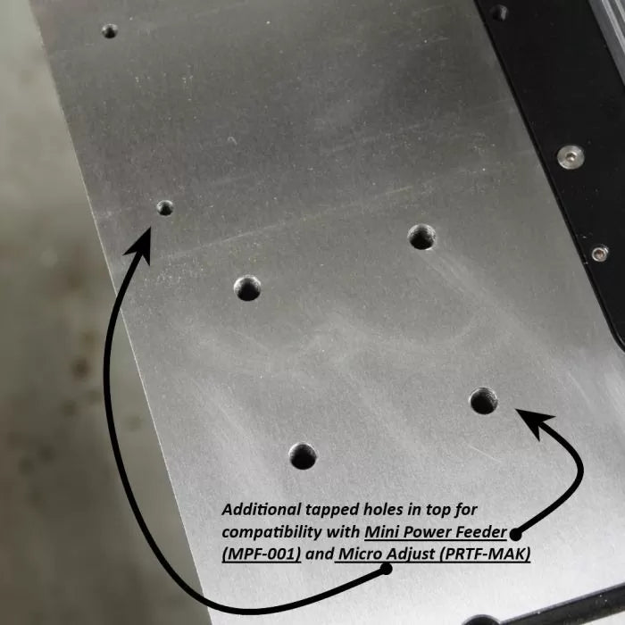 Aluminum router table top showing additional tapped holes for woodworking tool compatibility