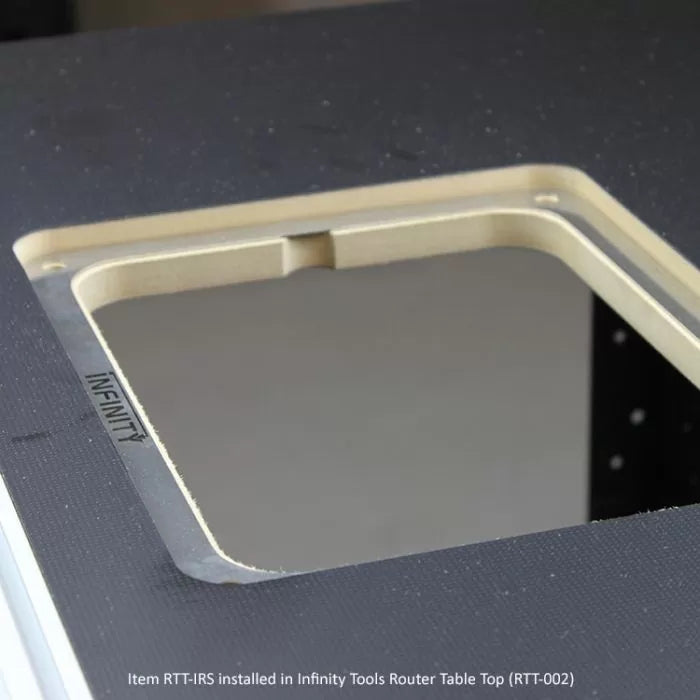 Router table insert plate installed in a black woodworking router table top