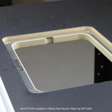 Router table insert plate installed in a black woodworking router table top