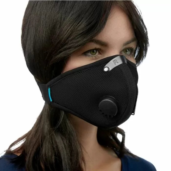 Woman wearing black mesh dust mask with breathing valve and adjustable nose clip, closeup