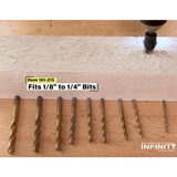 Assorted woodworking drill bits 1/8 to 1/4 inch displayed on a wooden workbench.