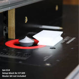 Router table setup with a white setup block and router bit insert, woodworking tool accessory.