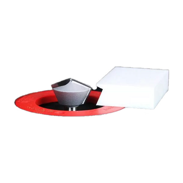 Carbide router bit set in a red insert ring with a white sharpening block for woodworking