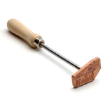 Woodburning branding iron with wooden handle for marking woodworking projects