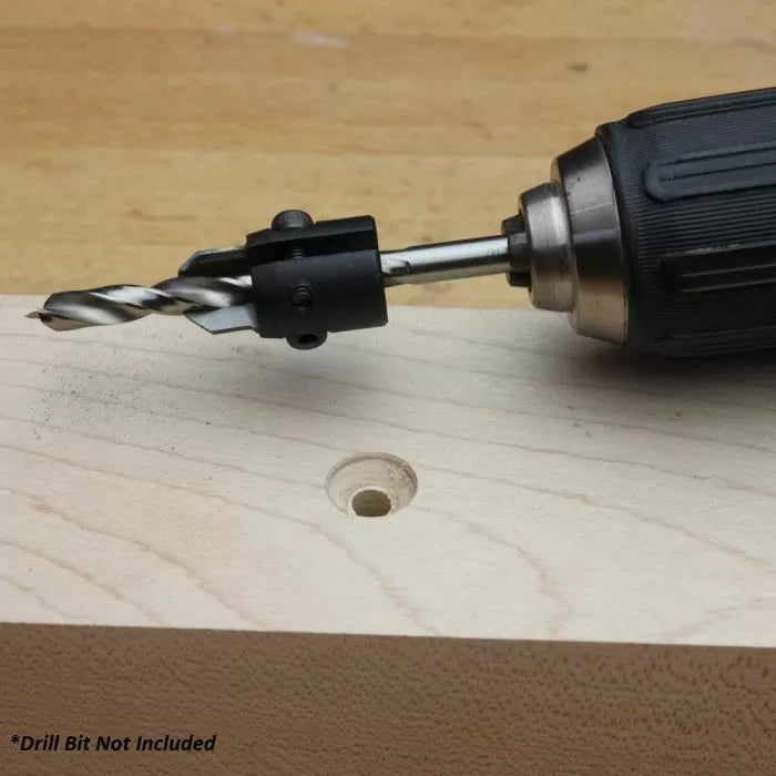 Depth stop drill accessory attached to a drill making precise hole in wood block