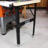 Adjustable steel router table leg set with leveling feet in a workshop setting