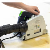 Track saw with dust collection hose cutting wood, woodworking tool in use