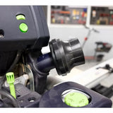 Close-up of a woodworking tool dust extraction port with control knobs in a workshop setting