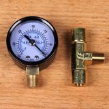Vacuum pressure gauge and brass T-fitting for woodworking dust collection on wood surface