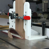Table saw tenoning jig cutting wood with vertical and horizontal clamps in woodworking shop