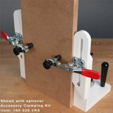 Woodworking clamping jig kit securing a wooden board for precise cutting or assembly