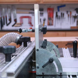 Router table fence system with wood board setup in woodworking workshop