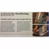 Professional vertical router sled in use on a table saw with hands guiding wood for woodworking.