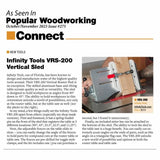 Infinity Tools VRS-200 vertical router sled on a workbench, holding a wood piece at an angle.