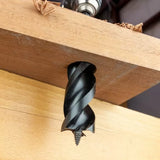 Large wood auger drill bit boring clean hole through hardwood board