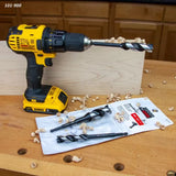 Cordless drill with brad point drill bit, wood shavings, and WoodOwl drill bits on workbench